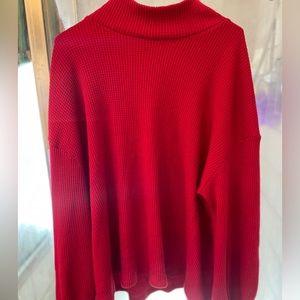 Red long sleeve women’s shirt.